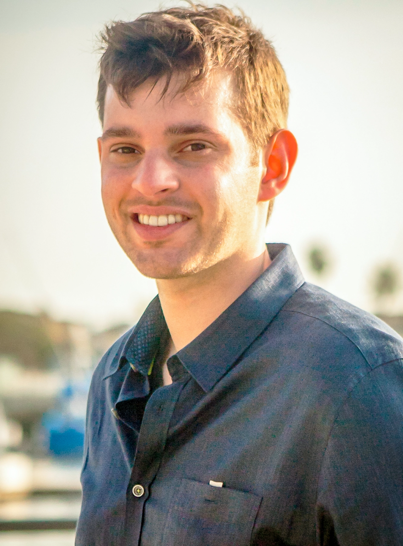 Casey-Head-Shot-1MB Professional headshot of Casey J. Simon, PsyD, LMFT in soft outdoor light.