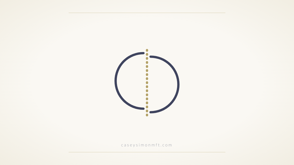 Two circle halves slightly out of alignment, joined by a dotted gold seam