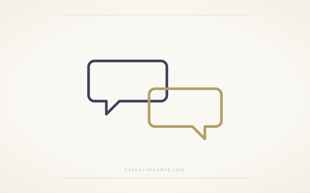 Two outlined speech bubbles meeting, one slate and one gold