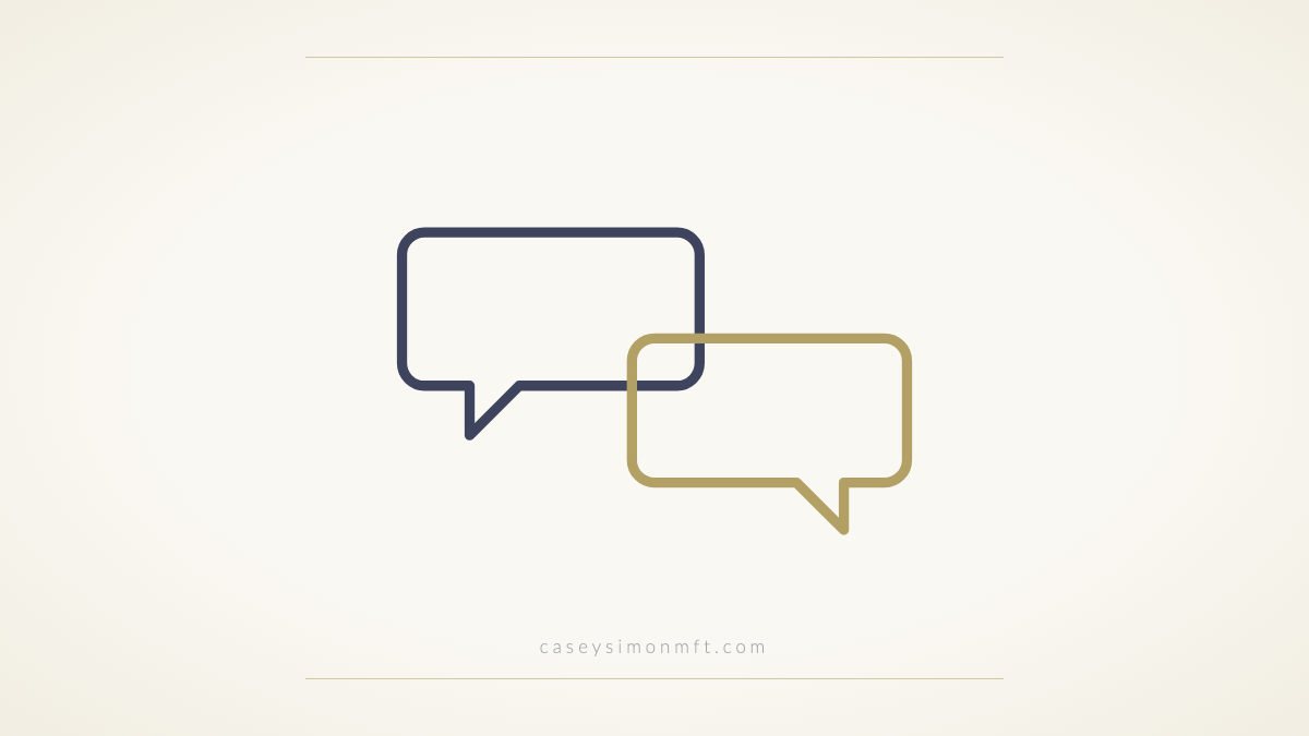 Two outlined speech bubbles meeting, one slate and one gold